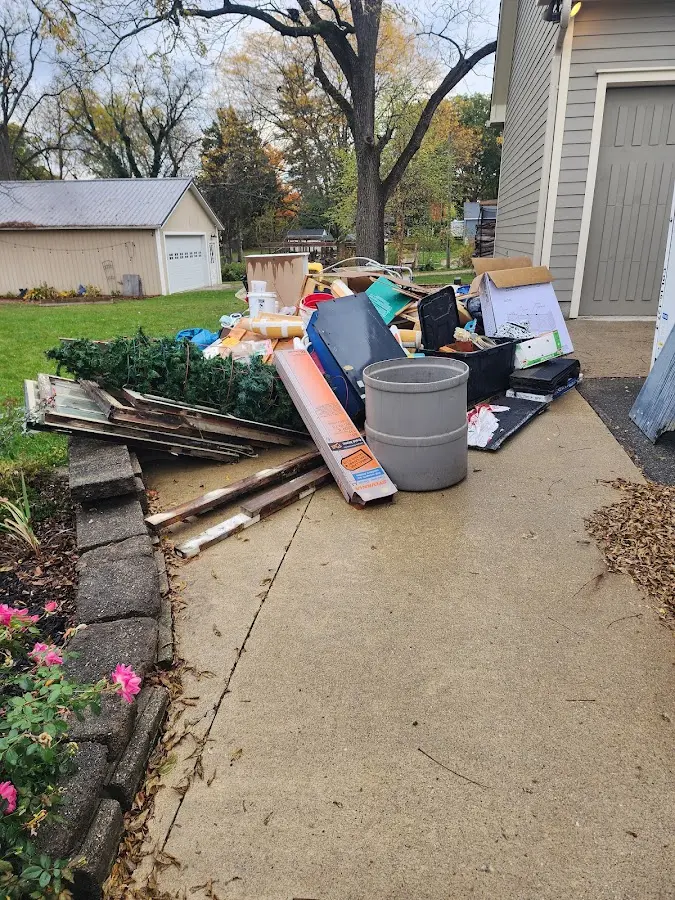 Dumpster being loaded with debris for Roofing Dumpster Rental in Attleboro